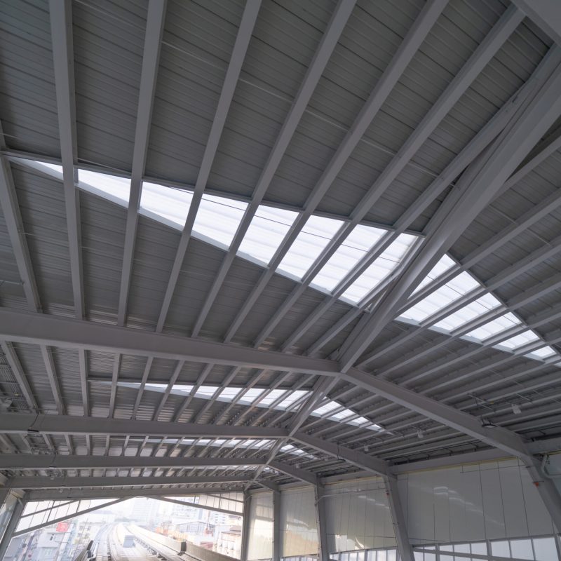 Steel structure of modern terminal station building roof. Metal windows glass facade frames supported. Abstract interior architecture design decoration background.