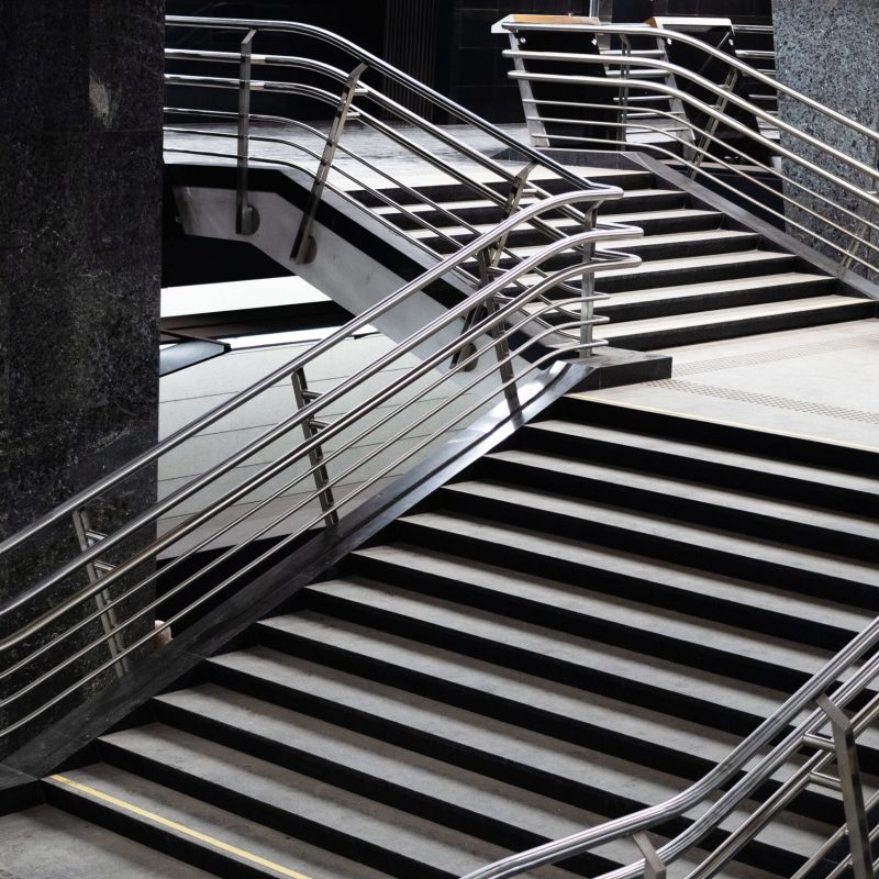 stairs with steel railings in grey and black underground passage of metro station